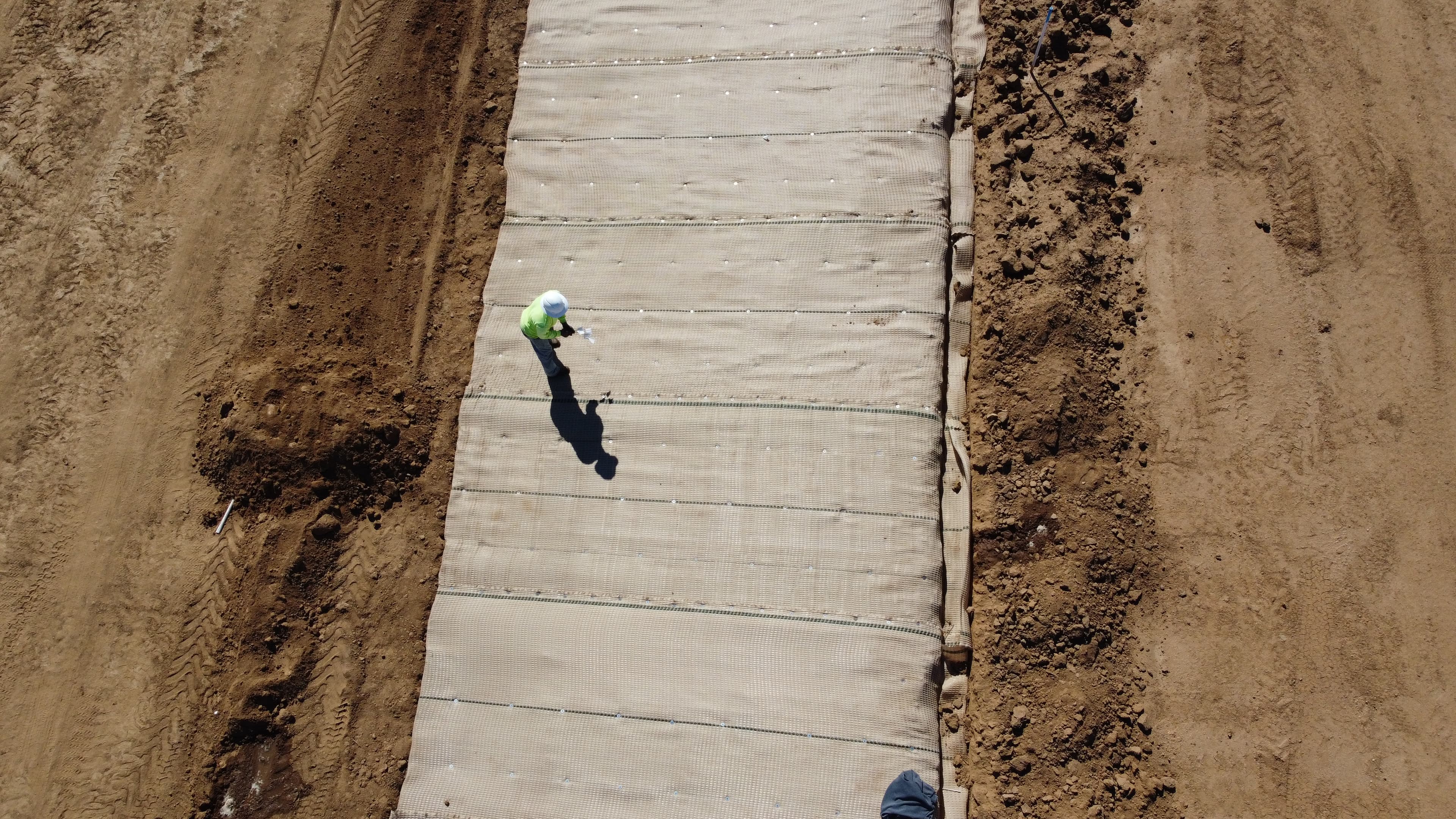 The integration of PROPEX Scourlok® at the slope's base and PROPEX Armormax® above maximizes erosion control in vulnerable areas, ensuring long-term stability and vegetative growth for effective landscape management.