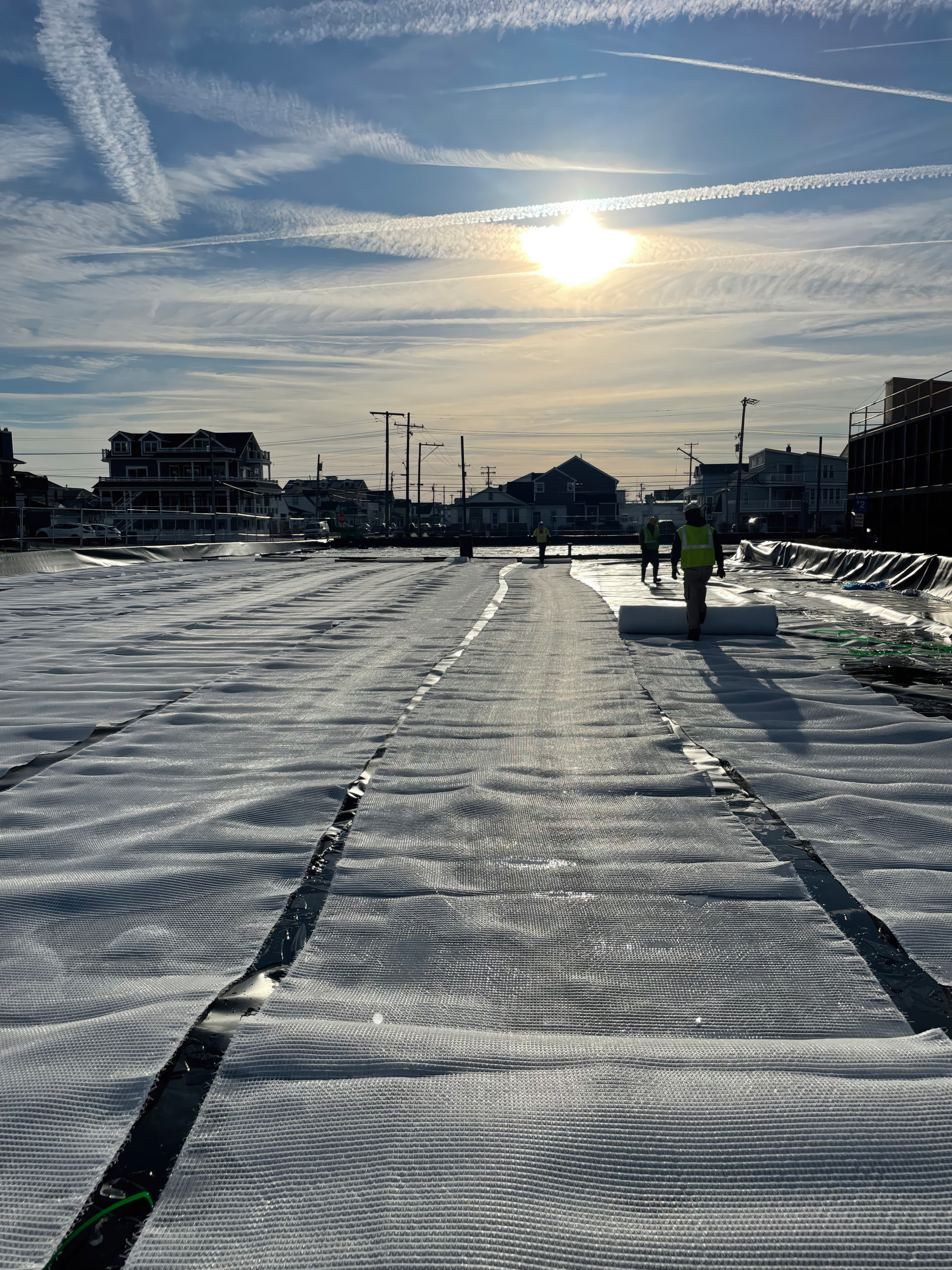 Dredged sand and silt pumped into GEOTUBE GT500 for containment.