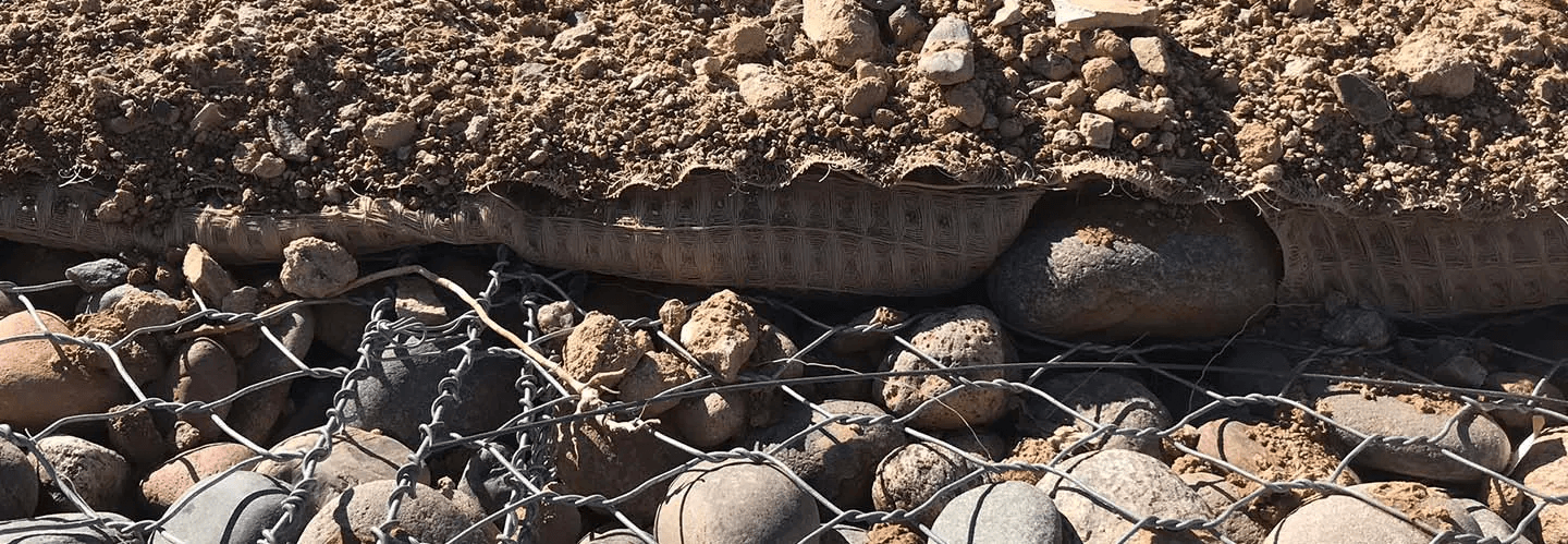 PROPEX Pyramat can be effectively combined with traditional engineering solutions such as concrete, rock riprap, and gabions using specialized connection techniques that ensure stability and durability in various installation scenarios.