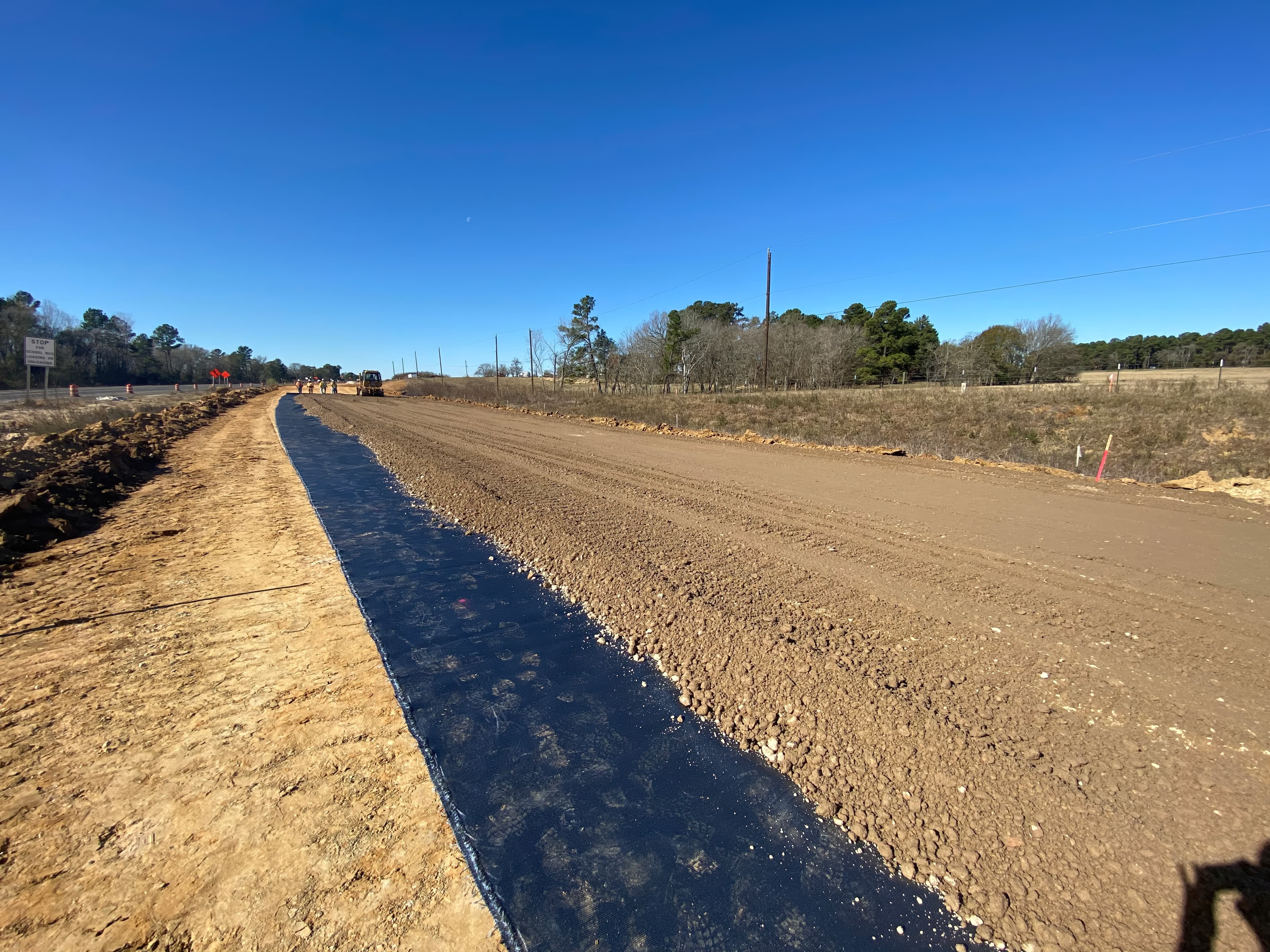 During excavation, natural springs were uncovered in the westbound lane, saturating the subgrade