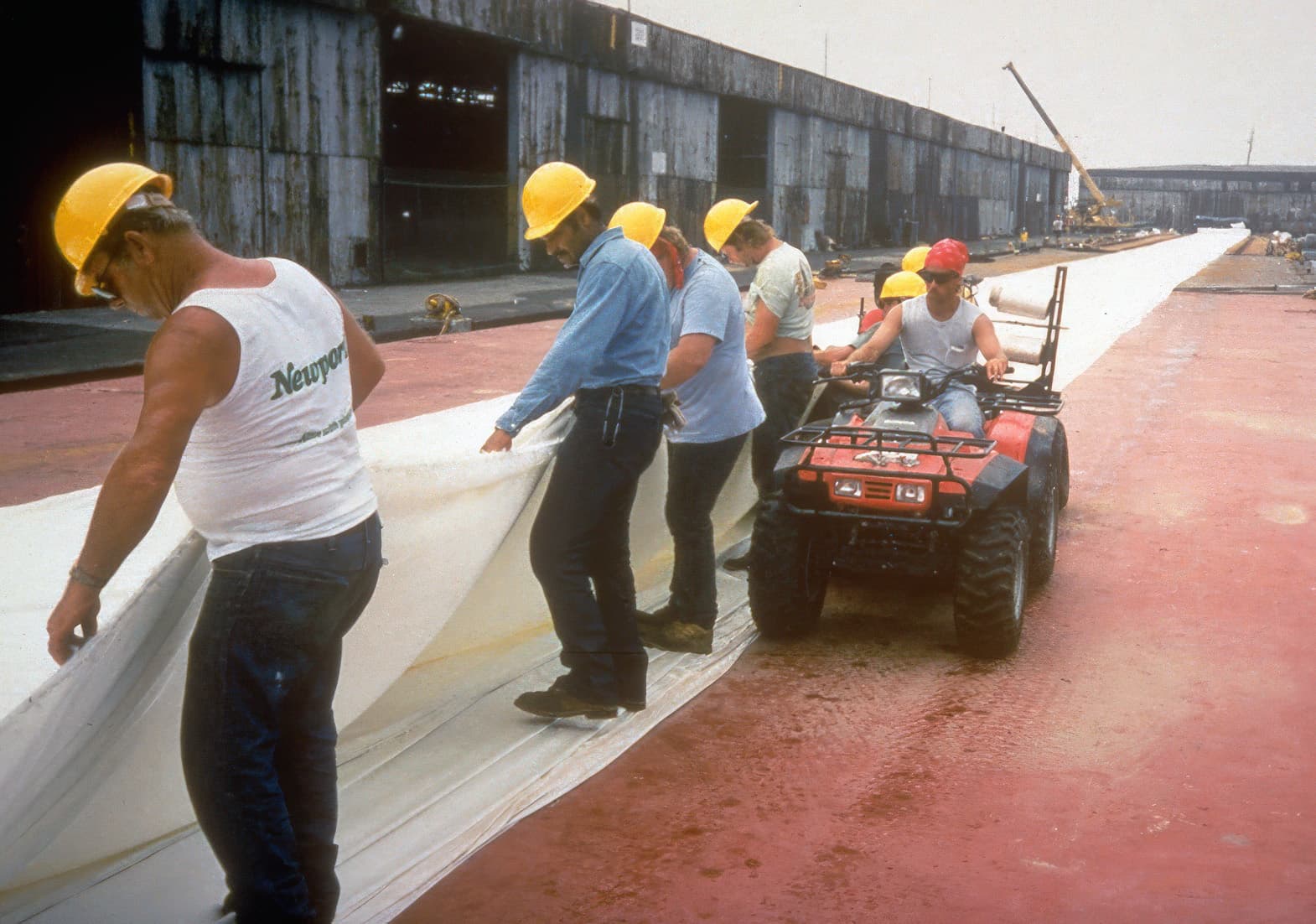Hydraulically placed sand fill was added in lifts under 1 m, forming a shallow 1V:20H slope to maintain stability over the soft organic clay.