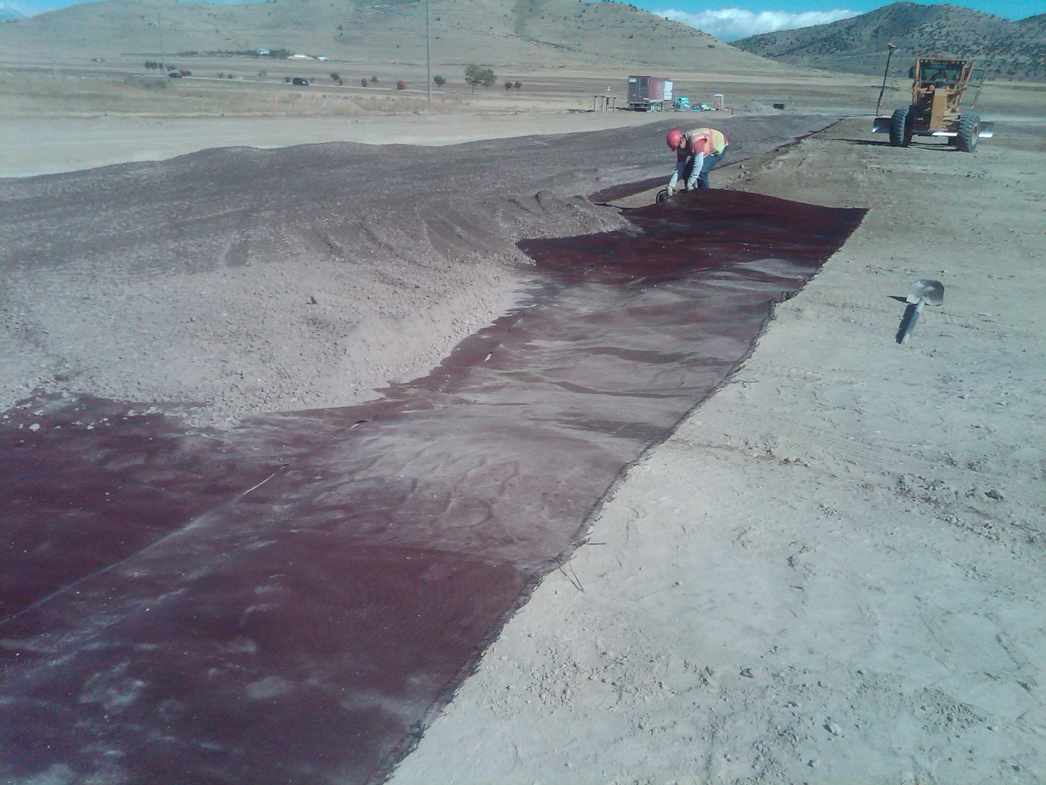 Following the installation of MIRAFI RS580i, construction of the new pavement section begins